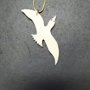 Cream colored bird pendant necklace
